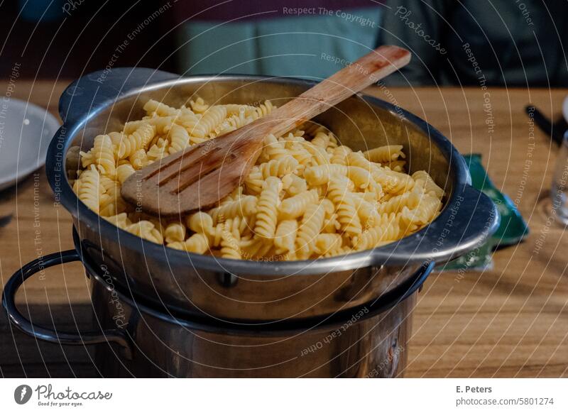 Authentic kitchen scene with a pot of fresh pasta on a dining table boil Dinner Noodles Eating Lunch Cooking Meal Kitchen Nutrition Food Delicious