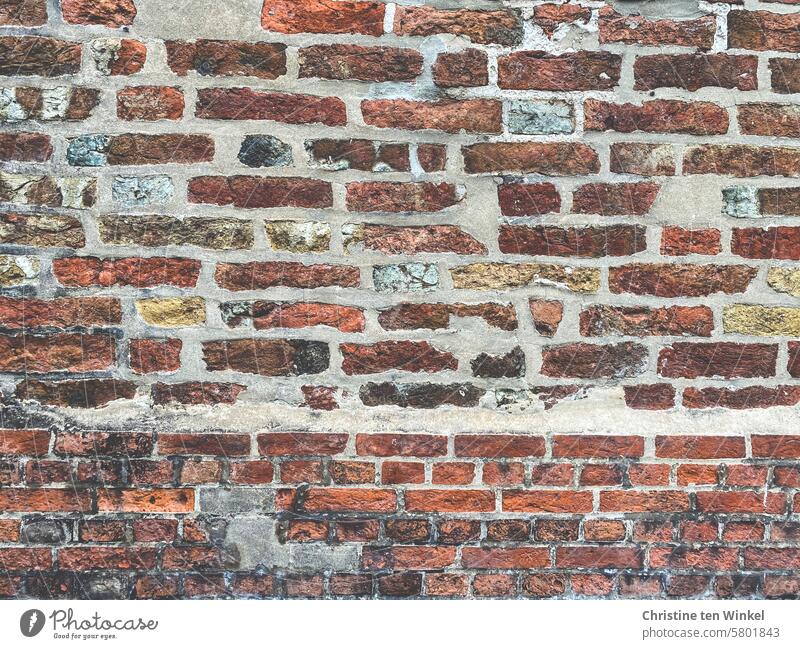 Repaired old brick wall Facade masonry Rustic bricks stones Brick wall Wall (barrier) Wall (building) Old Bricks repaired Red Stone Structures and shapes