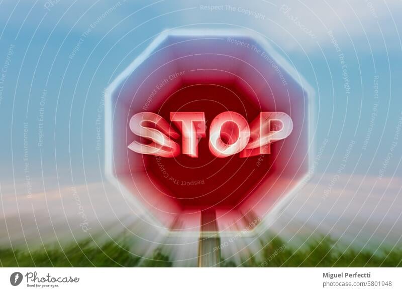Stop traffic sign, obtained with the zooming effect, rapid movement of the lens zoom. Close-up. stop stop sign zoom effect warning signal blurred octagon
