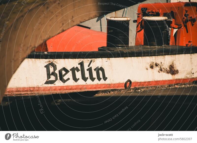 A ship in safe harbor Berth Inland navigation Historic Capital letter Typography Berlin Weathered Past Nostalgia Name Ravages of time Style Authentic