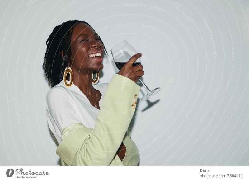 Portrait of joyful Black woman drinking wine at office party fun frieday drunk laugh Party portrait celebrate Friday businesswoman workplace alcohol positive