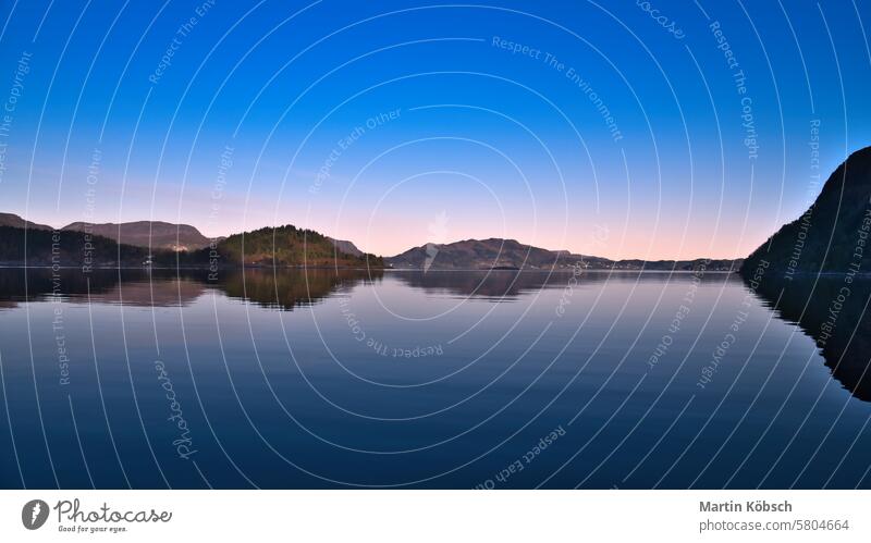 Fjord with view of mountains and fjord landscape in Norway. Landscape in evening sunset wilderness nature nordic panorama romantic fresh water sky recreation