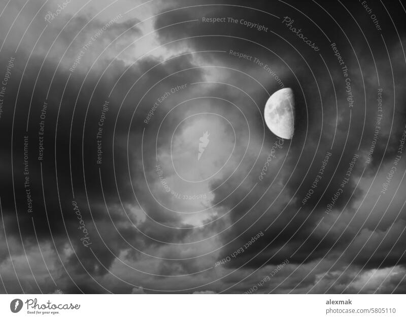 Moon in the dark cloudy sky moon moonlight satellite planet astronomy celestial lunar astrology clouds sphere night shadow orbit crater dusk landscape round
