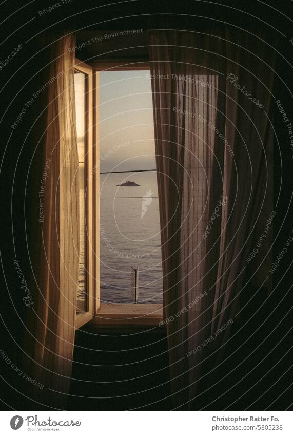 View of the sea through a curtain in summer during sunset. Sunset Summer Beautiful weather Beauty & Beauty Dusk Twilight relaxation Leisure and hobbies