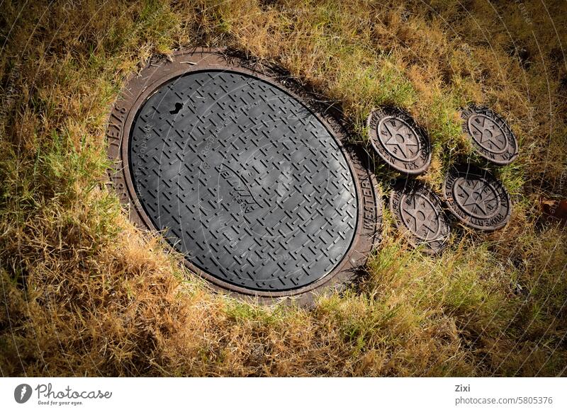Big and small sewer covers sewer hole Sewer big and small grass