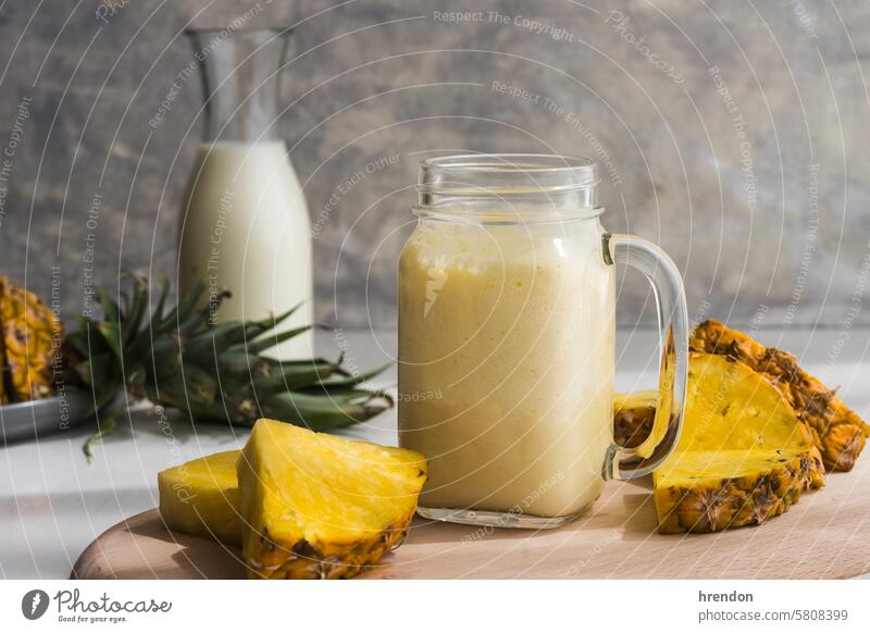 healthy pineapple smoothie in a glass jar on a grey background drink food fruit yellow organic tropical detox cream exotic slice breakfast juice diet cocktail