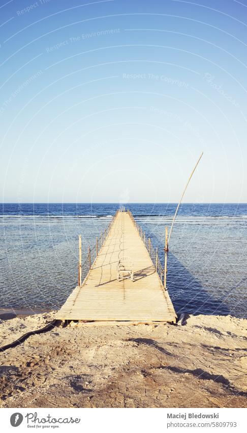 Old wooden pier at the sea, color toning applied. nature sky water landscape ocean beach summer travel old sun Egypt Marsa Alam Red Sea coast horizon bridge