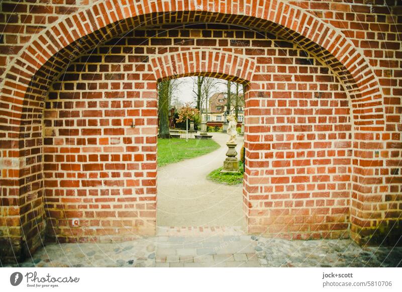 City wall with passage to the park Historic medieval Passage Stone wall Arch Tourist Attraction Vintage Masonry Historic Buildings Portal Old Neuruppin