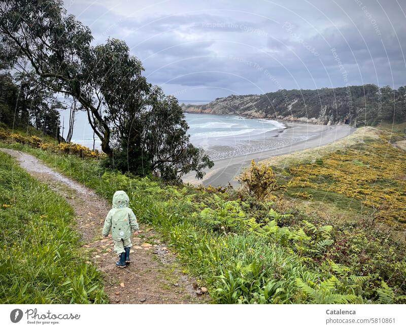 Little girl runs to the beach, it's raining daylight Horizon Ocean Nature vacation Vacation & Travel Beach Landscape Waves Surf High tide Low tide Clouds Water