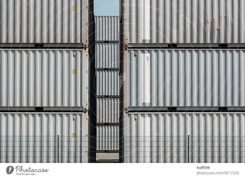 Many containers stacked behind a fence Container Container terminal Container cargo container wall container goods Logistics Industry Trade Metal Rust Warehouse