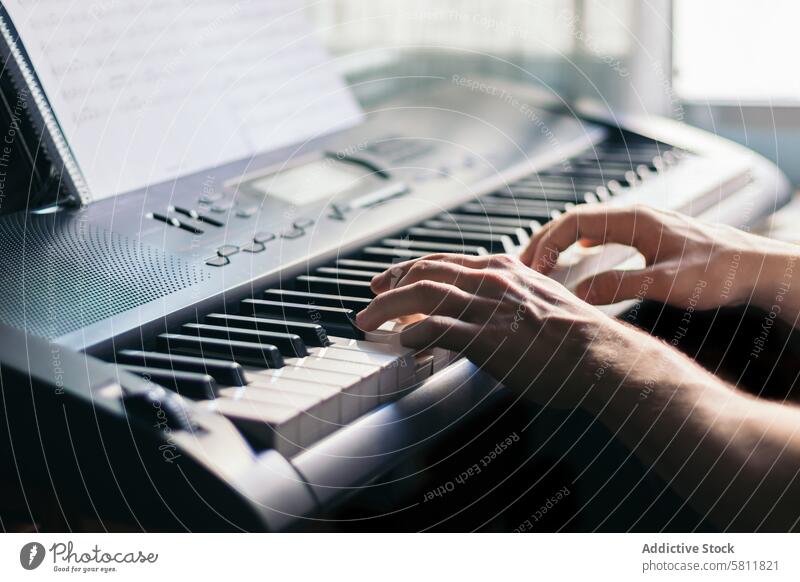 man playing piano with a music sheet instrument musician pianist black melody classic sound performance concert classical jazz entertainment person artist male