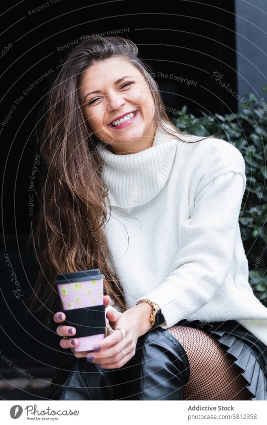 Smiling woman with cup of coffee dream smile happy drink charming dreamy female adult beverage relax free time lifestyle rest enjoy hot drink lady positive