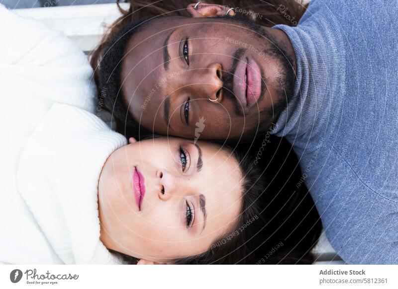 Loving multiethnic couple resting together love romantic face relationship affection close relax happy young multiracial diverse african american black