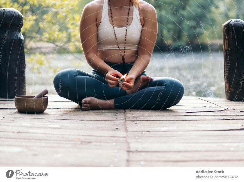 Young woman meditating and doing yoga in nature meditation healthy relaxation body adult pose lifestyle balance exercise young person concentration zen peaceful