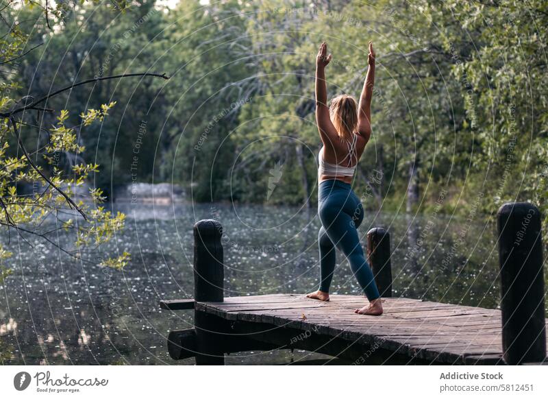 woman in sportswear doing yoga outdoors near a lake healthy exercise lifestyle fitness body workout caucasian training pilates young wellness activity active