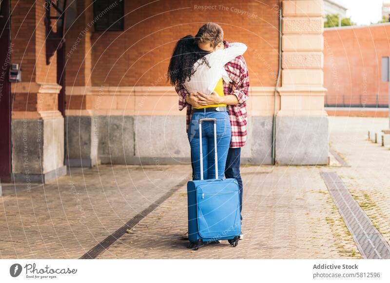 Reunited at last!: Young couple meeting at the station after a trip travel young happy transportation love tourism tourist journey smiling relationship traveler