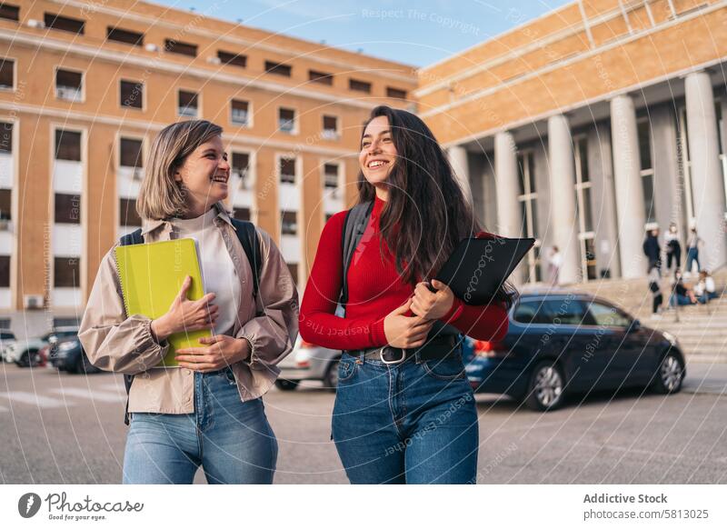 two student girls leaving class students university school young happy education bag backpack outside building joyful studying teenager modern lifestyle casual