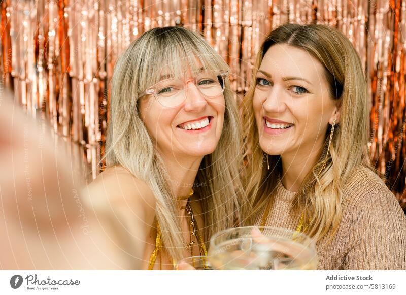 Cheerful women with glass of champagne cheerful happy smile girlfriend joy positive female together glad style delight enjoy content toothy smile summer young