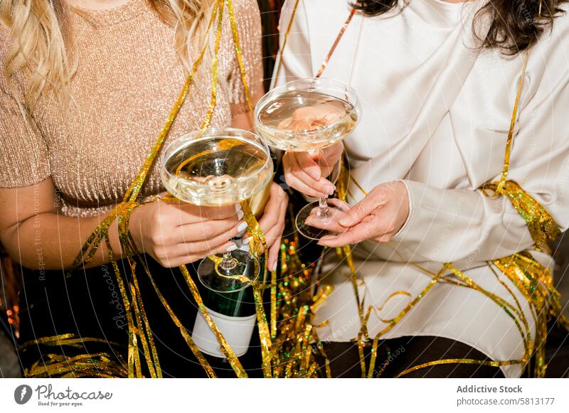 crop of woman at Party Making Champagne Toast Together person drink party glass wine cheer friends alcohol celebrate holiday group female fun hand beverage