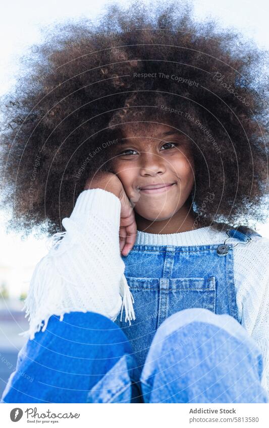 Smiling black teen girl with curly hair afro kid positive smile denim child portrait hairstyle female african american ethnic teenage cheerful content happy