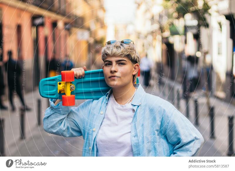 stylish teenager girl with short hair and a skate. portrait female caucasian skateboard lifestyle woman urban hipster young summer people happy skater youth