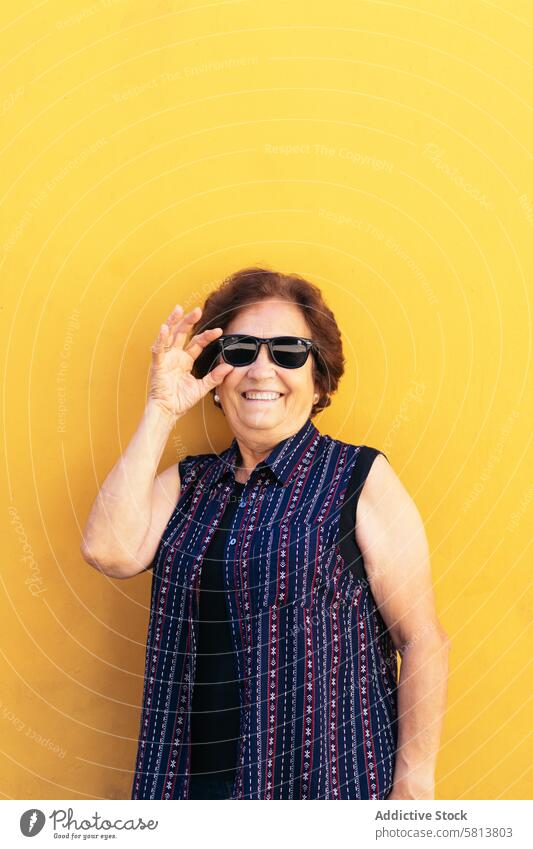Stylish old woman in sunglasses and colorful clothes copy space stylish senior female lifestyle people caucasian happy lady elder smile confident leisure
