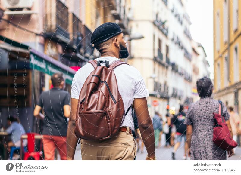 Stylish black man walking on the city street lifestyle young urban male person stylish guy outside people casual looking happy outdoors trendy adult fashion