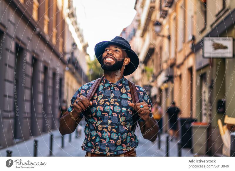 Stylish black man walking on the city street lifestyle young urban male person stylish guy outside people casual outdoors adult fashion summer handsome