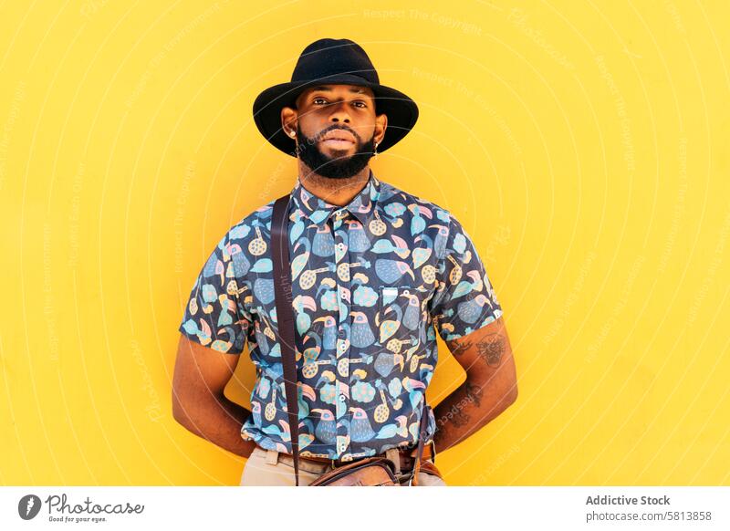 Stylish black man outdoors over yellow background lifestyle city young street urban male person stylish guy outside people casual adult fashion summer handsome