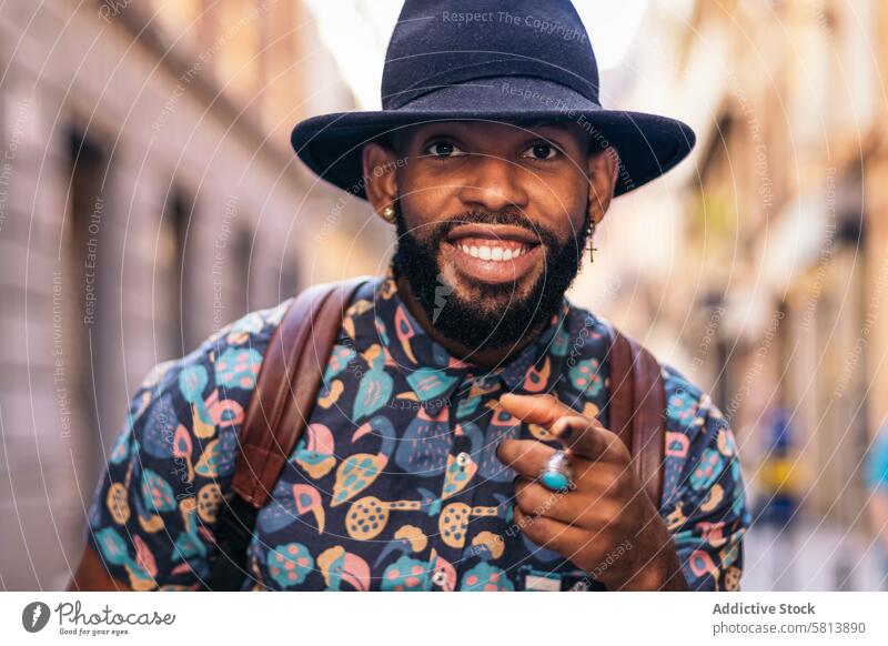 Stylish black man having fun on the city street lifestyle young urban male person stylish guy outside people casual outdoors adult fashion summer handsome