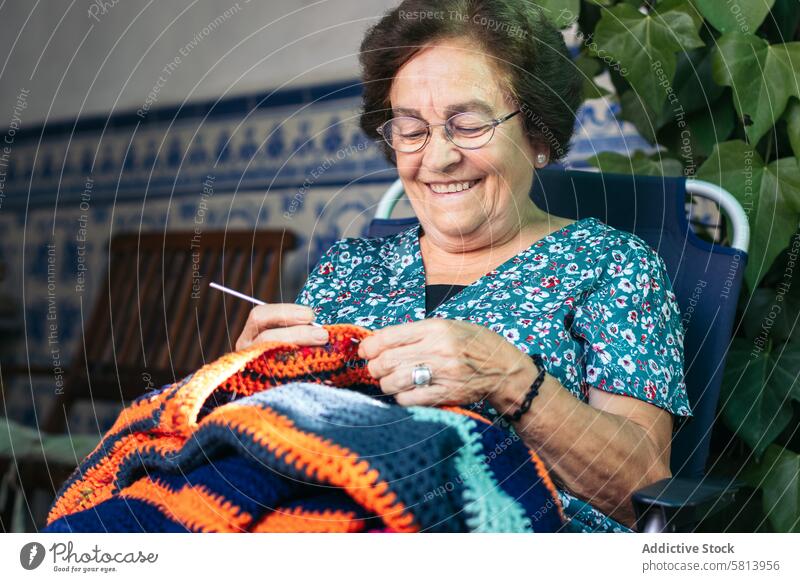 Granny Hobbies: Older Woman Crocheting woman older crochet grandmother leisure activity hobby granny needle age elderly handmade adult knit wool lifestyle