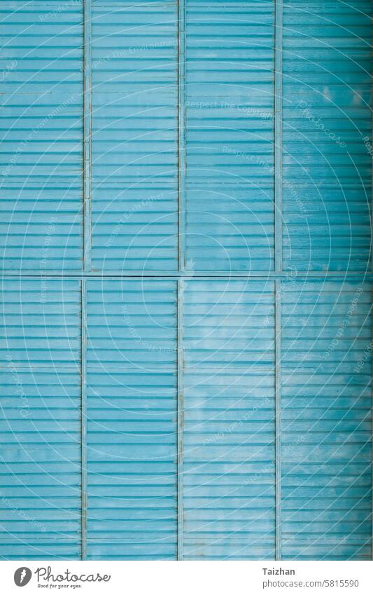 Ribbed meatl door texture background . Old blue gate as background . Copy space abstract architecture blank building coated coating construction corrugated