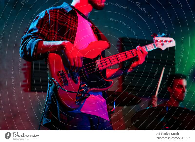 Bass Player In Stage With Colorful Lights music stage bass concert player musician entertainment sound background instrument band live rock performer musical