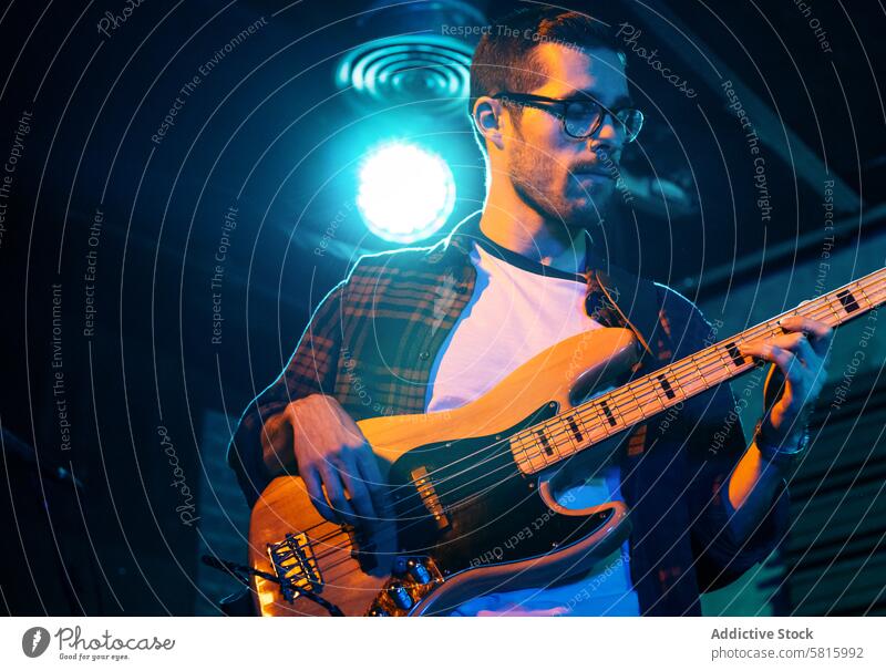 Bass Player In Stage With Colorful Lights music stage bass concert player musician entertainment sound background instrument band live rock performer musical