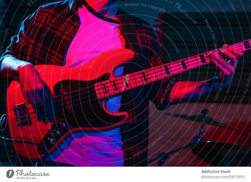 Bass Player Performing In A Live Concert music stage bass concert player musician entertainment sound background instrument band live rock performer musical