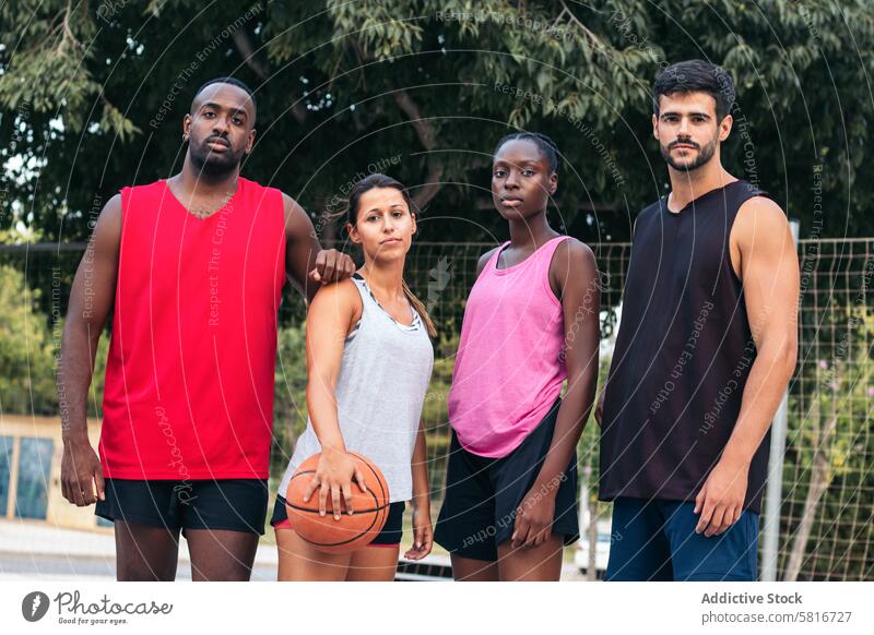 Multiracial Basketball Players United on the Court friends basketball multiracial sport fun young game court team lifestyle player urban outdoor group