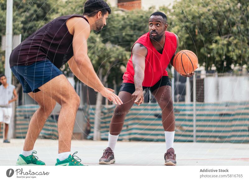 Men Dominating the Basketball Court friends basketball multiracial sport fun young game court team lifestyle player urban training outdoor group street athlete