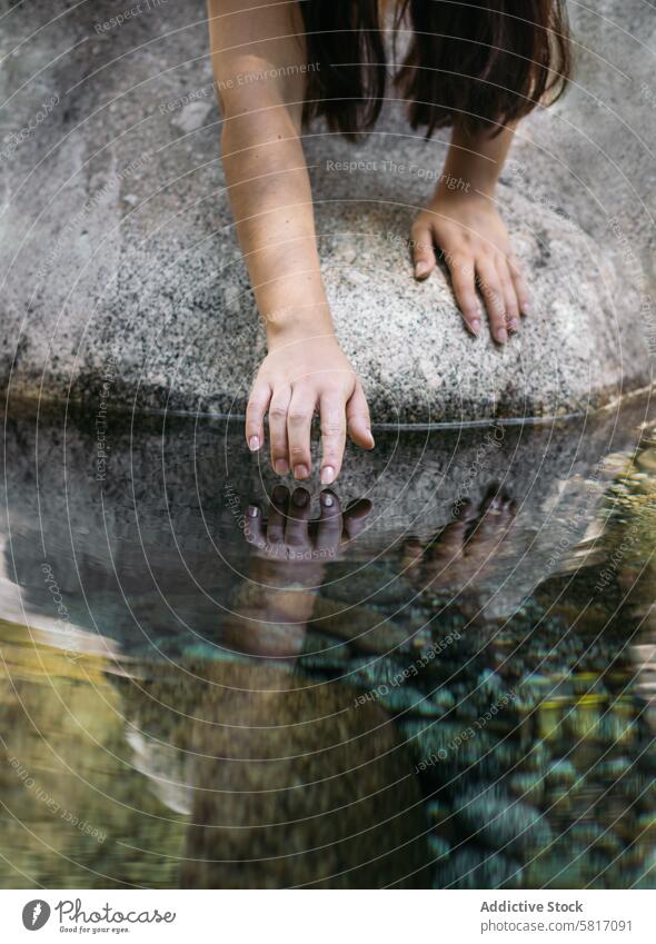 Close up of a hand touching the water of the river nature young rock outdoor forest travel woman pool female sitting vacation natural landscape summer relax