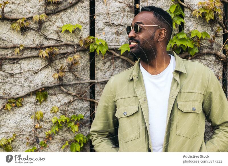 stylish and attractive african american young man with sunglasses portrait male handsome fashion black model casual style guy person lifestyle cool happy trendy