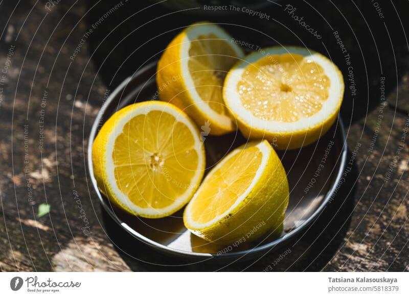 Fresh lemons arranged neatly on a rustic wooden table, ready to be used for refreshing lemonade or zesty recipes citrus vitamin food fruit vegetarian yellow