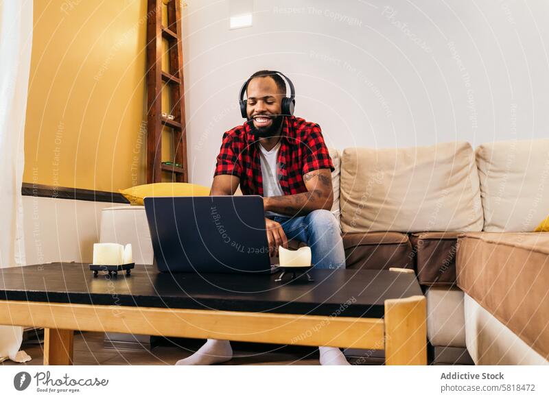 African american man making work video call with laptop at home computer african american internet remote online using black modern indoors distance device