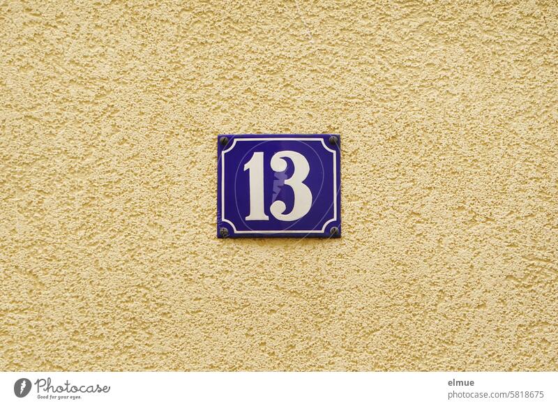 Everything will be fine I blue sign with the number 13 on a house wall Number 13 thirteen House number Unlucky number Digits and numbers Signs and labeling