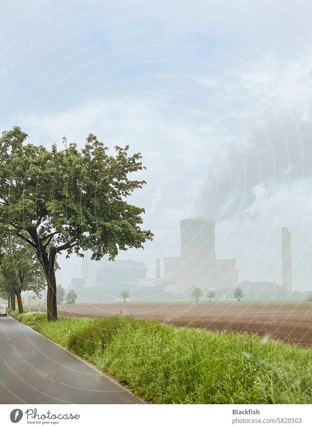 Green nature and fields with a steaming power station in the background Energy Climate change cooling tower Emission Energy industry Coal power station Industry