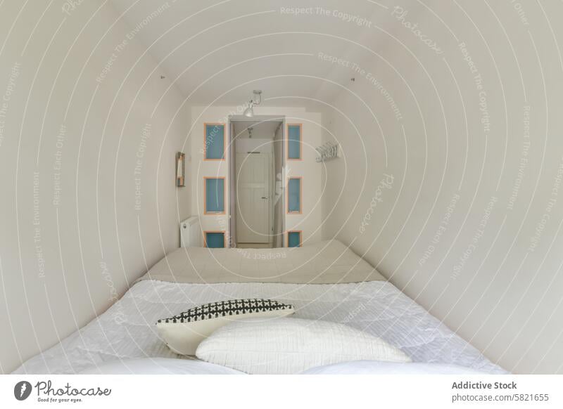 Minimalist bedroom interior with cozy white bedding minimalist orteliusstraat 346hs design accent blue peach tone comfort home decoration mattress pillow sheet