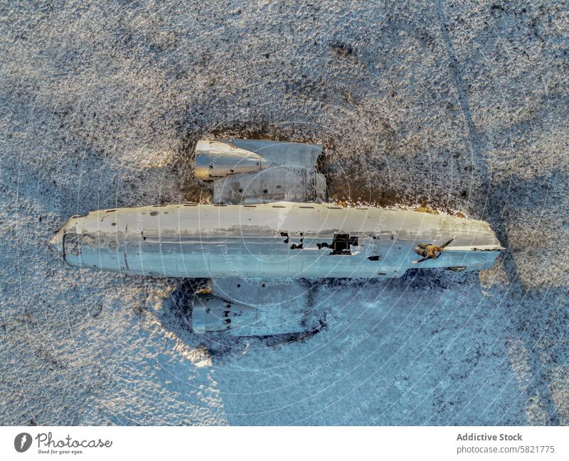 Aerial view of a crashed airplane in the snowy landscape of Iceland iceland aerial abandoned derelict weathered terrain frozen desert dereliction solitude
