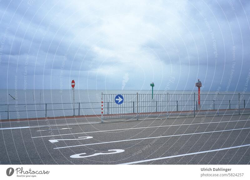 Traffic lanes at the ferry terminal with traffic signs for ships and cars in the Wadden Sea Transport Ferry Mud flats coast North Sea Island voyage