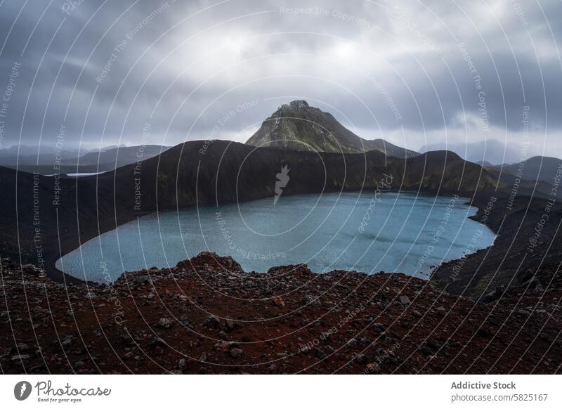 Overcast skies over volcanic crater lake in Iceland iceland highland landscape overcast sky moody nature outdoor travel destination icelandic geology geothermal