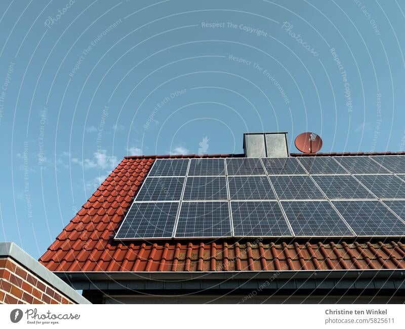 A house roof with photovoltaics, partly already cleaned, partly still dirty Photovoltaic Modules neat frowzy Tiled roof Roofing tile green energy Climate change