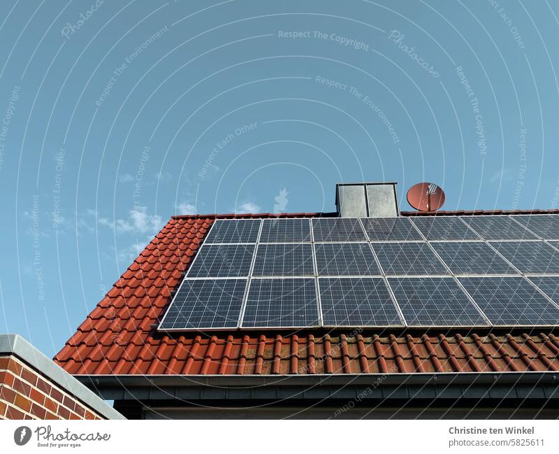 A house roof with photovoltaics, partly cleaned, partly still dirty Photovoltaic Modules neat frowzy Tiled roof Roofing tile green energy Climate change Energy