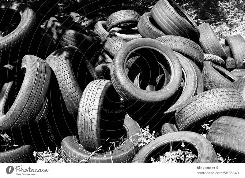 Used tires in nature Car tire old car tires Rubber tires Tire scrap tyres Trash Environmental pollution Black Tire tread Dispose of Dirty Structures and shapes
